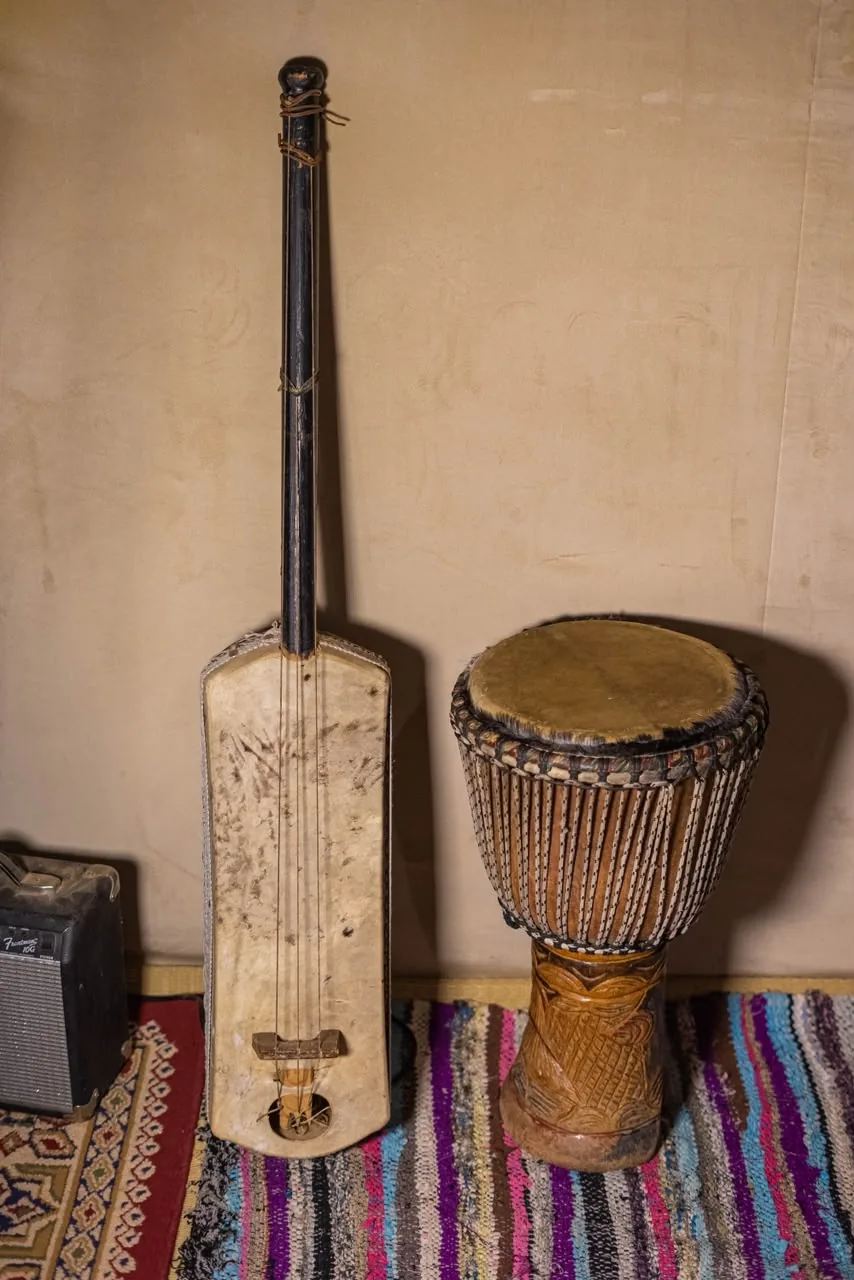 Traditional Berber instruments, guembri and djembe, at the camp